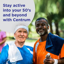 Two active men in their 50s holding water bottles and towels next to Centrum ad promoting activity