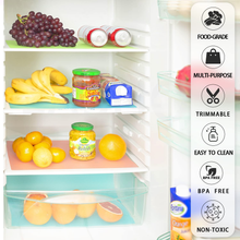 Colorful refrigerator shelf liners washable on fridge shelves holding fruit bananas grapes jars and cans