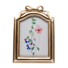 5X7-Gold-Bow-Detail-Resin-Tabletop-Picture-Frame_197fc648-8e69-4a24-b9b4-cdf8cef9d2dd.868f49b7e8c2dd1e49684586b0b4ddc7 - Brands For Less USA