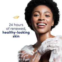 Smiling woman with foamy skin showing effects of Dove Deep Moisture body wash 2 pack for healthy skin