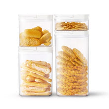 8-piece pantry storage container set with clear airtight containers filled with various snacks