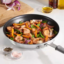 Brands For Less USA aluminum nonstick fry pan with gray handle cooking shrimp and peppers