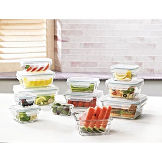 Glasslock 24-piece food storage set clear glass containers with white lids filled with assorted fruits and prepared meals