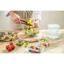 Glasslock 24-piece food storage set glass containers shown with salads fruits and stacked lids on counter