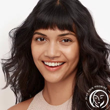 Smiling woman with clear skin representing the benefits of Olay Total Effects face moisturizer SPF 15