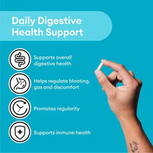 Hand holding a capsule with Physician's Choice 60 Billion Probiotic capsules supporting digestive and immune health